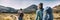 New Zealand Hiking Couple Backpackers Tramping At Tongariro National Park. Male and female hikers hiking by Mount