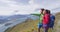 New Zealand hiking couple on mountain top Roys Peak enjoying active lifestyle