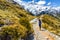 New zealand hiking girl hiker on Mount Cook Sealy Tarns trail in the southern alps, south island. Travel adventure