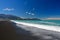 New Zealand landscape with the town Kaikoura, mountains and an ocean with turquoise water