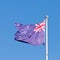 New Zealand national flag banner flying on pole