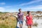 New Zealand. People hiking in beach nature landscape in Ship Creek on West Coast of New Zealand. Tourist couple