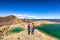 New Zealand popular tourist hiking hike in Tongariro Alpine Crossing National Park. Tramping trampers couple hikers