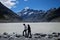 NEW ZEALAND, SOUTH ISLAND, MOUNT COOK - FEBRUARY 2016: An unidentified couple explores Mount Cook,New Zealand. Working holiday
