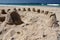 New Zealand: summer beach sand castles h