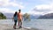 New Zealand tourists couple visiting Wanaka Lone Tree walking by lake