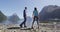 New Zealand Tourists hiking in Milford Sound by Mitre Peak in Fiordland