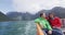 New Zealand travel tourists relaxing on boat tour Cruise ship in Milford Sound, Fiordland National Park, New Zealand