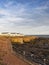 Newbiggin by the Sea`s Church Point with Holiday Park at low tide, Northumberland, UKRocks and sandstone cliffs at Church Point,