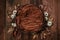 Newborn autumn background - wooden bowl with fall leaves and cream pumpkins on dark wooden planks backdrop