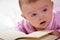 Newborn baby with a book