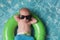 Newborn Baby Boy Floating on an Inflatable Swim Ring