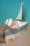 Newborn Baby Boy Sailor Sleeping in a Sailboat