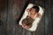 Newborn Baby Boy Sleeping in a Rustic Crate