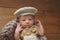 Newborn Baby Boy Wearing a Newsboy Cap and Bowtie
