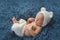 Newborn Baby Boy Wearing a White Bear Costume