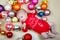 Newborn baby with Christmas tree decoarations and colorful toys and balls