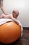 Newborn baby exercising on a gymnastic ball