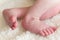 Newborn baby feet on a blanket