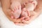 Newborn baby feet in mommy\'s hands