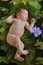 Newborn baby floating on green leaves in water pond of lotus flowers in nature