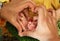 Newborn baby girl feet with rings in thumbs closeup heart shape saudi man holding hands family