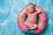 Newborn Baby Girl Wearing a Pink Polka Dot Bikini