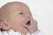 Newborn baby girl yawning