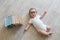 Newborn baby in glasses with books. A little boy in white clothes and blue . Beautiful portrait of a toddler. Big-eyed baby. Remot