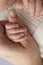 The newborn baby has a firm grip on the parent& x27;s finger after birth.