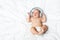 newborn baby with headphones