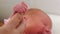 Newborn baby holds patential finger. Closeup. Parenthood. Motherhood. Happy family Mother and her infant together. Tiny