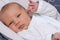 Newborn baby lying in bouncer chair