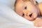 Newborn baby lying on a white background