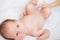 Newborn baby lying on a white background