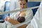Newborn baby in mother`s arms in