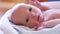 newborn. baby newborn a close-up lies looking at the camera in the hospital maternity hospital. lifestyle happy family