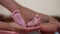 Newborn Baby`s feet.Mother holding newborn baby legs