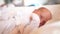 Newborn baby sleep. Boy infant sleep lies in a child bed. happy family birthday closeup baby concept. Cute baby close up