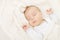 Newborn baby sleeping, covering soft woolen blanket