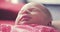 Newborn baby sleeping on father`s lap 4K