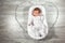 Newborn baby sleeps in a special orthopedic mattress Baby cocoon, on a wooden floor and heart from garlands. Calm and