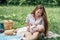 Newborn baby spending time outside. Happy and smiling mother with her newborn baby spending time in the park. Getting