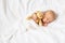 Newborn baby with teddy bear