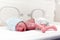 Newborn boy covered in vertix in incubator