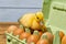 Newborn Duckling sitting on eggs in a green paper tray.