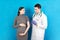 Newborn family concept. A pregnant woman with the hand of a doctor to vaccinate ,nurse vaccinating young girl having a child or