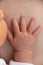 Newborn hand on chest