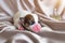 newborn jack russel terrier puppy dog sleep on fabric and decoration in portrait pet concept