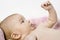 Newborn little girl on pink towel